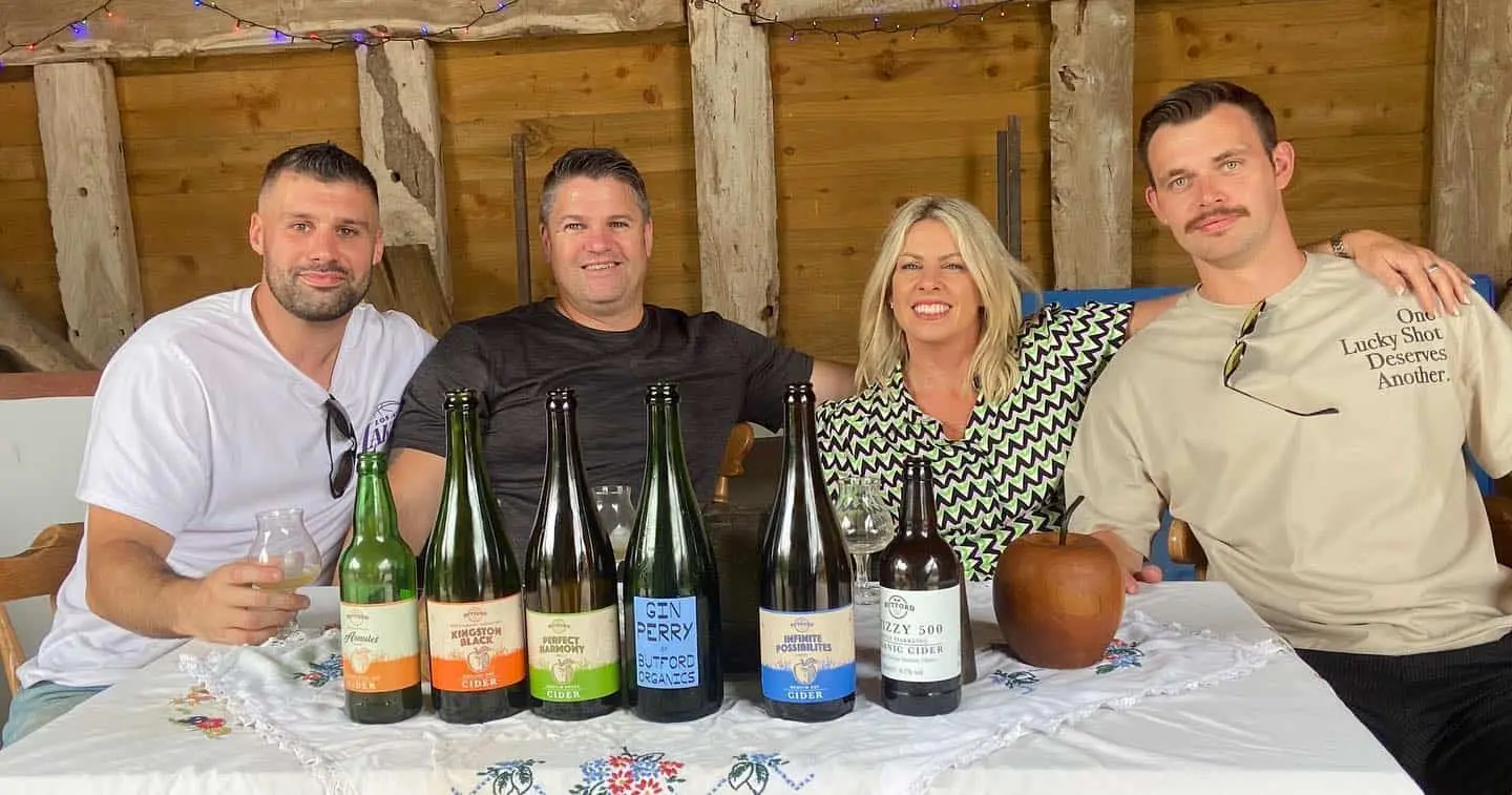 Guests enjoying a cider tasting during an orchard tour